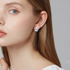 Elegant square halo stud earrings with brilliant white cubic zirconia worn by a model