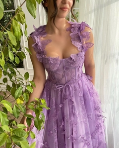 Detailed 3D butterfly embroidery on high-slit purple tulle bridal gown with corset