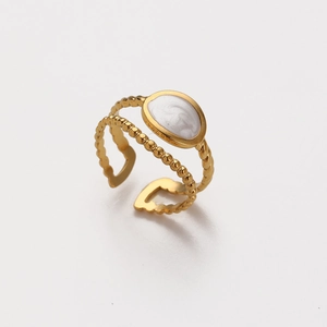 Detail of adjustable 18K gold plated ring with white enamel and golden bead band design