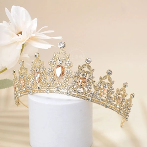 Detailed macro view of vintage gold crown with champagne teardrop crystals and rhinestones