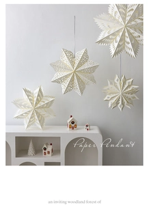 Detailed view of white hollow paper stars for Christmas home and window decorations