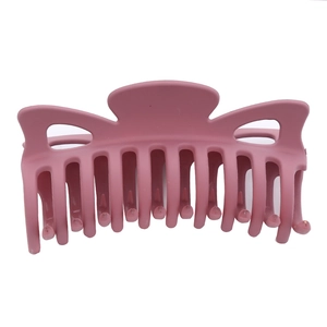 Matte pink 12cm bow claw clip for thick hair shown on a clean white background