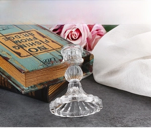 Detail of vintage Nordic glass candle holder with a ribbed base and elegant clear texture