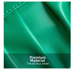 Close-up of bright green litchi grain leather fabric with precise stitching detail