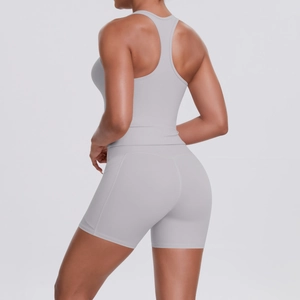 Detail of grey racerback sports bra and high-waist shorts set for fitness and yoga