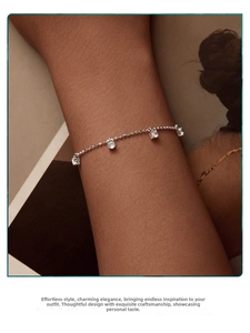 Detail of s925 silver beaded bracelet with four sparkling cubic zirconia stones on wrist