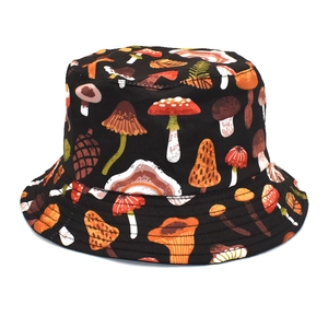 Detailed view of colorful mushroom patterns on a black foldable fisherman bucket hat