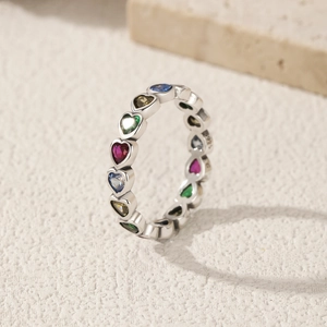 S925 sterling silver ring with colorful heart-shaped gemstones on textured stone