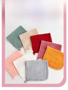Detailed texture of multi-color six-layer cotton muslin burp cloths with hanging loops