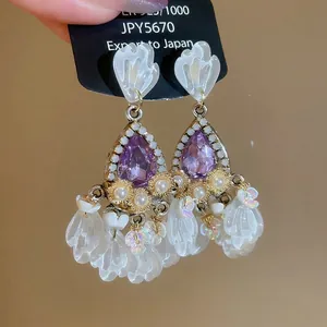 Elegant purple drop crystal earrings with white petal tassels and pearl accents