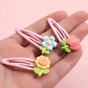 Set of 3 cute children floral BB hair clips featuring resin flowers and pink metal grips