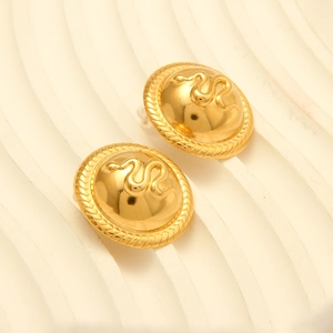 Detailed view of vintage 18k gold plated snake embossed dome earrings for women