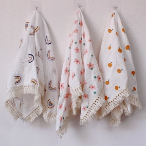 Three-pack cotton gauze baby blankets with tassel trim in rainbow and floral prints