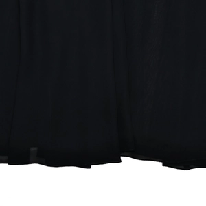 Detailed macro view of black sheer fabric showing smooth texture and soft drape