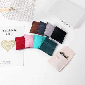Minimalist faux suede jewelry pouches with envelope flap closure in multiple macaron colors