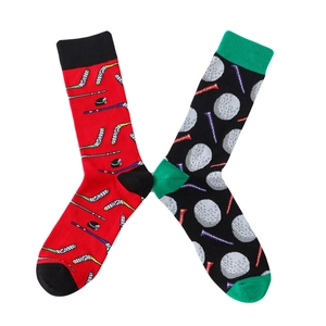 Detail of knit cotton socks with red hockey patterns and black golf ball designs