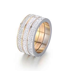 Three-piece interlocking eternity rings set with pave crystals in gold, silver, and rose gold
