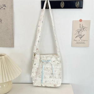 Aesthetic white lace shoulder bag featuring cute bear patterns and light blue ribbon bow
