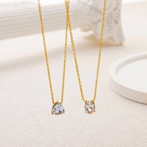 Elegant gold necklaces with pear and oval zircon pendants on minimalist O-chains