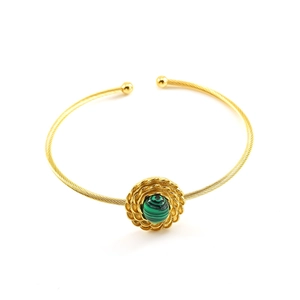 Golden twisted rope bangle with green malachite stone inlay on a plain white background