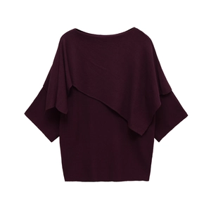 Elegant asymmetrical burgundy knit top with chic cape-style layered design and boat neckline