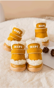 Detail of warm dog boots with lamb wool lining and non-slip rubber soles for winter