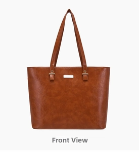 Detail view of a brown faux leather tote bag with gold metal plaque and top handles