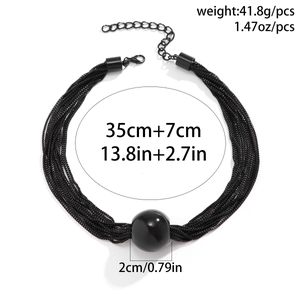 Detail view of layered punk choker with dimensions of 35+7cm and a 2cm black sphere bead