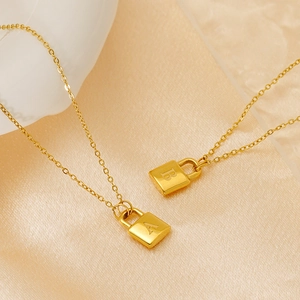 Titanium steel padlock pendant necklace with personalized letters on silk background