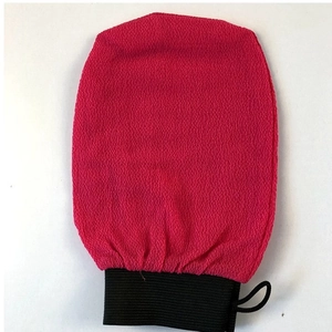 Exfoliating Moroccan bath mitt in rose red with sand texture and black wristband