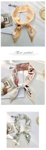 Macro detail of silk print twilly scarves with letters E F G and floral patterns