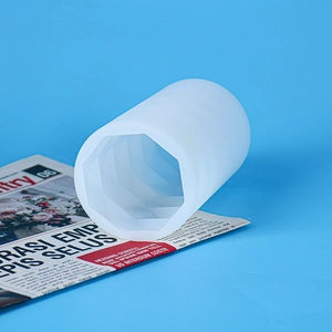 Detail of translucent cylindrical silicone mold with hexagonal hollow structure for DIY crafts