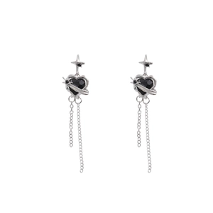 Silver fringe earrings featuring black heart crystals and sparkling star accents