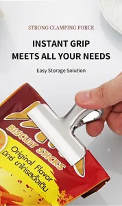 Macro detail of large stainless steel T-shape food clip sealing a snack bag tightly