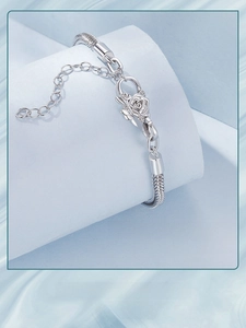 Detail of S925 sterling silver Chopin chain bracelet with a delicate rose flower clasp