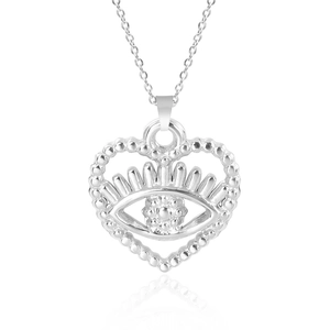 Close-up of heart-shaped evil eye pendant in silver stainless steel on white base