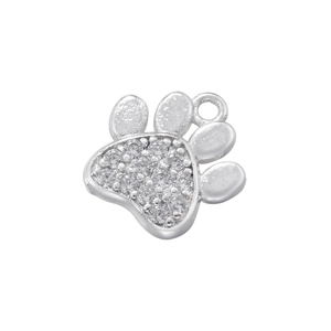 Detailed close-up of a silver paw print pendant with clear zircon stone inlay
