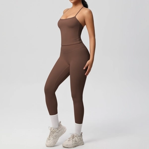 Detail of high-waisted seamless chocolate yoga leggings and thin strap sports top set