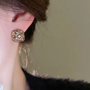 Elegant gold-plated square stud earrings with champagne rhinestones for a vintage luxury look