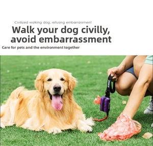 Purple pet waste bag dispenser attached to a leash during outdoor dog walking