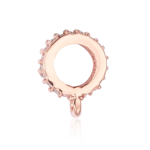 Macro detail of rose gold pendant clasp with micro-pave clear cubic zirconia stones