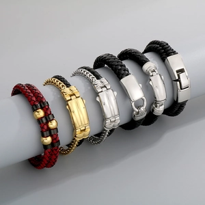 Detail of multi-layer men's braided leather bracelets with stainless steel clasps