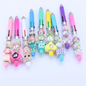 Detail of colorful DIY beaded pens with various acrylic charms and pastel colors