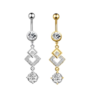 Detailed view of silver and gold belly rings with geometric diamonds and cubic zirconia
