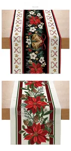 Detailed view of Christmas table runners with festive poinsettia and bell patterns