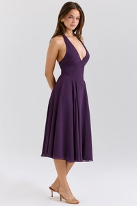 Detail of elegant dark purple halter dress with a deep V-neck and flowing A-line chiffon skirt