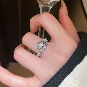 Detail of snake-shaped wrap ring with shimmering cubic zirconia on an adjustable band
