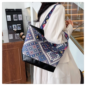 Ethnic tote bag with geometric woven pattern and adjustable wide shoulder strap detail