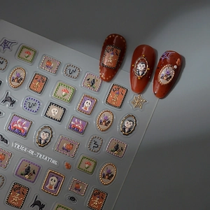 Halloween nail art stickers with gold embossed pumpkins, ghosts, and spider webs