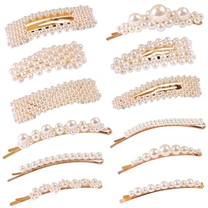 12-piece pearl hair clip set featuring gold alloy bases and white faux pearls in various styles